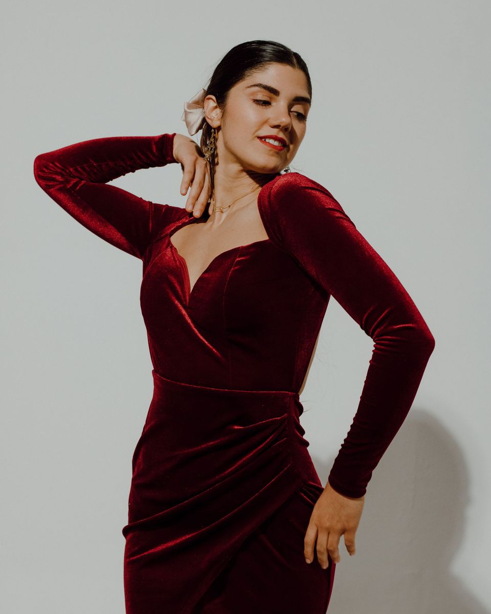 Style photo: a maroon dress similar in mood to the PRETTYGARDEN One-Shoulder Bow Maxi