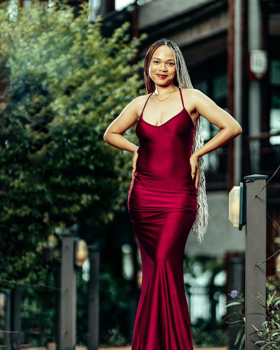 Style photo: a maroon dress similar in mood to the Azazie Lucienne Strapless Stretch Satin Gown