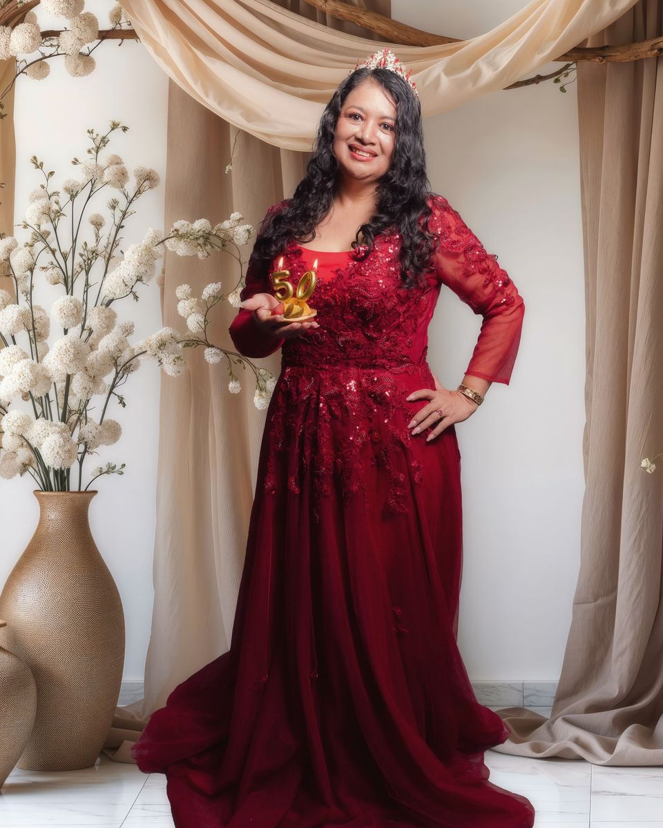 Style photo: a maroon dress similar in mood to the Azazie Leonia Long-Sleeve Stretch Satin Gown